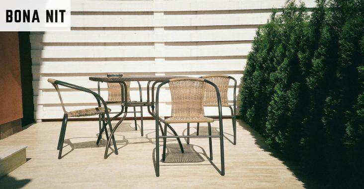 black metal framed white wooden table and chairs